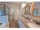 Modern bathroom featuring double sinks, granite countertops, and sleek glass shower at 453 Mulberry Rock Rd Rd, Temple, GA 30179