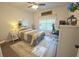 Cozy bedroom with natural light, stylish decor, and a comfortable bed at 453 Mulberry Rock Rd Rd, Temple, GA 30179