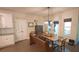 Bright dining room with window light, rustic wooden table, and bench seating at 453 Mulberry Rock Rd Rd, Temple, GA 30179