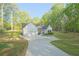 A long driveway leads to this new construction home with an attached two car garage in a lush setting at 453 Mulberry Rock Rd Rd, Temple, GA 30179