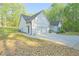 Beautiful new construction home with a white exterior, an attached two car garage, and black accents at 453 Mulberry Rock Rd Rd, Temple, GA 30179