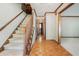 Inviting foyer with wood flooring and staircase leading to the upper level at 929 Hampton Nw Trl, Lilburn, GA 30047