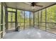 Enjoy the outdoors on the screened porch with views of the surrounding trees at 929 Hampton Nw Trl, Lilburn, GA 30047