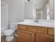 This bathroom has a toilet, shower, and a light wood vanity with sink at 1188 To Lani Farm Rd, Stone Mountain, GA 30083