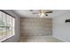 This bright bedroom includes a decorative wall and natural light from the window at 1188 To Lani Farm Rd, Stone Mountain, GA 30083