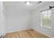 This bedroom is bright with hardwood floors and a large window for natural light at 1188 To Lani Farm Rd, Stone Mountain, GA 30083