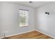 This bedroom boasts hard wood floors and a large window for natural light at 1188 To Lani Farm Rd, Stone Mountain, GA 30083