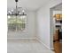 Bright living room featuring a decorative chandelier and light colored walls at 1188 To Lani Farm Rd, Stone Mountain, GA 30083