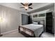 Neutral bedroom featuring carpet floors, ceiling fan, and ample natural light from the exterior window at 148 Waverly Way # 10, Atlanta, GA 30307