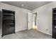 Bright bedroom featuring soft carpet, natural light, and a bookcase providing storage, creating a serene atmosphere at 148 Waverly Way # 10, Atlanta, GA 30307