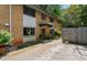 Beautiful brick condo showing the driveway, covered entryway, and lush landscaping around the property at 148 Waverly Way # 10, Atlanta, GA 30307