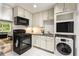 Functional kitchen equipped with black appliances, and sufficient storage space at 148 Waverly Way # 10, Atlanta, GA 30307