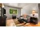 Bright living room featuring a large window with scenic outdoor views and stylish decor at 148 Waverly Way # 10, Atlanta, GA 30307