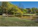 Scenic view of Springvale Park, featuring a serene pond, lush trees, and a well-maintained grassy area at 148 Waverly Way # 10, Atlanta, GA 30307