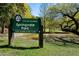 View of Springvale Park sign and a pond with trees in the background at 148 Waverly Way # 10, Atlanta, GA 30307