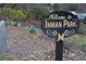Welcome to Inman Park sign with a gravel path and flowerbed behind at 148 Waverly Way # 10, Atlanta, GA 30307