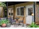 Cozy brick patio with seating area, plants, and lush green landscaping creates a relaxing outdoor space at 148 Waverly Way # 10, Atlanta, GA 30307