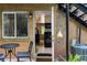 Brick patio featuring a view from the outside into the kitchen with sleek black appliances and modern cabinets at 148 Waverly Way # 10, Atlanta, GA 30307