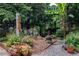 Landscaped yard with a gravel path, beautiful plantings, bushes and trees at 148 Waverly Way # 10, Atlanta, GA 30307