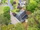 Aerial view showcasing the home's roof, landscaping, and surrounding wooded area with neighboring homes at 1633 Clifton Downs Ct, Kennesaw, GA 30144