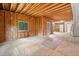 Spacious unfinished basement with wood framing and natural light from the surrounding windows at 1633 Clifton Downs Ct, Kennesaw, GA 30144