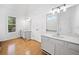 Bright bathroom with dual vanities, hardwood floors, and natural light at 1633 Clifton Downs Ct, Kennesaw, GA 30144