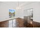 Bright dining room featuring dark hardwood floors and a view into other rooms at 1633 Clifton Downs Ct, Kennesaw, GA 30144