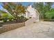 View of home showcasing the driveway, landscaping, and the side of the house at 1633 Clifton Downs Ct, Kennesaw, GA 30144
