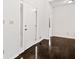 Bright foyer with hardwood floors, a white front door with glass panels, and white walls at 1633 Clifton Downs Ct, Kennesaw, GA 30144