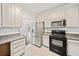 Open kitchen design with stainless steel appliances and granite counters, ready for entertaining at 1633 Clifton Downs Ct, Kennesaw, GA 30144