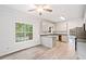 Bright kitchen features granite counters, stainless appliances, and light wood flooring at 1633 Clifton Downs Ct, Kennesaw, GA 30144