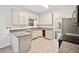 Well-lit kitchen with stainless steel appliances, granite countertops, and wood-look flooring at 1633 Clifton Downs Ct, Kennesaw, GA 30144