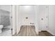 A laundry room with hardwood floors and white trim throughout at 1633 Clifton Downs Ct, Kennesaw, GA 30144