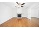 Open living space with hardwood floors, fireplace, and bright lighting at 1633 Clifton Downs Ct, Kennesaw, GA 30144