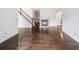 Living room features dark hardwood floors, white walls, and a fireplace at 1633 Clifton Downs Ct, Kennesaw, GA 30144