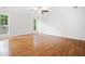 Open-concept living room with hardwood floors and bright windows showcasing scenic views at 1633 Clifton Downs Ct, Kennesaw, GA 30144