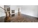Living room with dark hardwood floors, white walls, and a fireplace at 1633 Clifton Downs Ct, Kennesaw, GA 30144