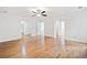 Large, light-filled living room features beautiful wood floors and an open floor plan at 1633 Clifton Downs Ct, Kennesaw, GA 30144