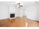 Open living space featuring hardwood floors, fireplace and large windows at 1633 Clifton Downs Ct, Kennesaw, GA 30144