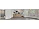 Finished basement with a stone bar, bathroom, and natural light at 2932 Springbluff Ln, Buford, GA 30519