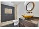 Modern bathroom featuring designer bowl sink, decorative tiles, and a walk-in shower at 2932 Springbluff Ln, Buford, GA 30519