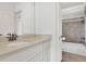 Bathroom featuring a single vanity with stone countertop and tub/shower combo at 2932 Springbluff Ln, Buford, GA 30519