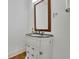 Bathroom featuring granite counters, wood floors, custom vanity and a framed mirror at 2932 Springbluff Ln, Buford, GA 30519