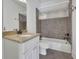 Cozy bathroom featuring a shower-tub combination, tile surround and granite countertop at 2932 Springbluff Ln, Buford, GA 30519