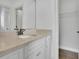 Bathroom featuring a single vanity with stone countertop and access to closet at 2932 Springbluff Ln, Buford, GA 30519