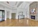 Spacious primary bedroom boasts hardwood floors, a stone fireplace, and tray ceilings at 2932 Springbluff Ln, Buford, GA 30519