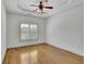 Bedroom with hardwood floors, a ceiling fan, and a large window with views at 2932 Springbluff Ln, Buford, GA 30519