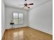 A bedroom featuring hardwood floors, crown molding, and bright natural light at 2932 Springbluff Ln, Buford, GA 30519