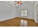 Bedroom with hardwood floors, neutral paint and a window with bright light at 2932 Springbluff Ln, Buford, GA 30519