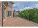 A spacious wooden deck provides an excellent view of the wooded backyard at 2932 Springbluff Ln, Buford, GA 30519